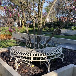 Picture of Half Tree Surround and Half Garden Curved Bench Metal Antique White The Complete Garden