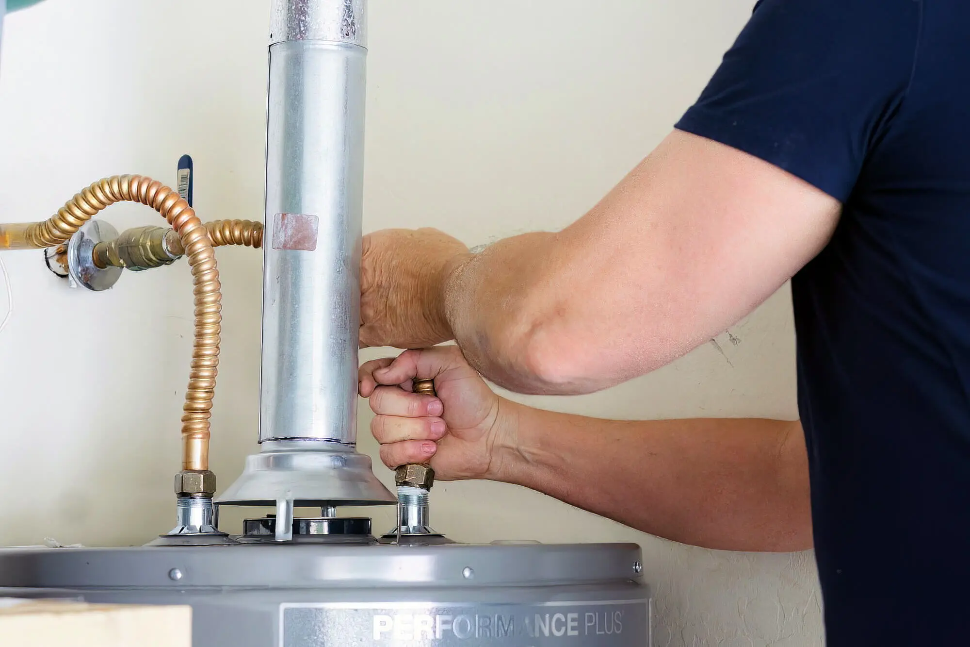 Plumber Inspecting Hot Water Heater Plumber Inspecting Hot Water Heater