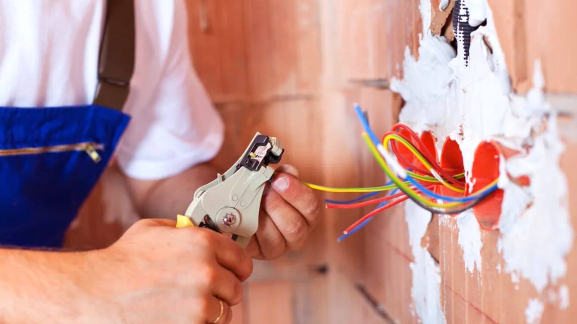 Commercial Electrician Attaching Wires Build