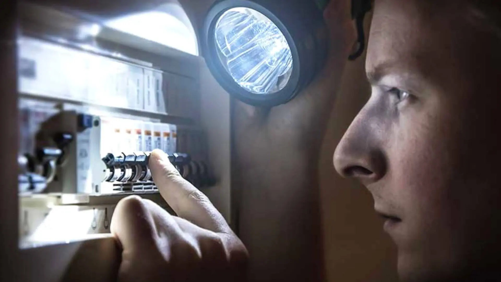 Homeowner Checking Safety Switch Power Outage