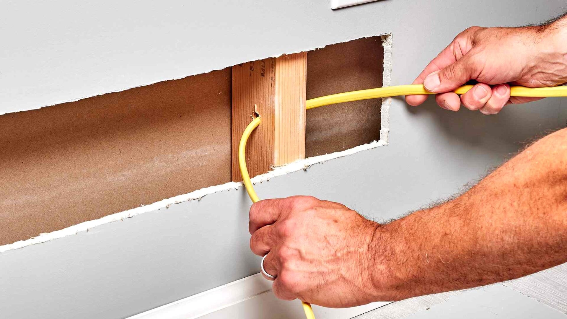 Electrician Installing Wiring In Wall Electrician Installing Wiring Wall