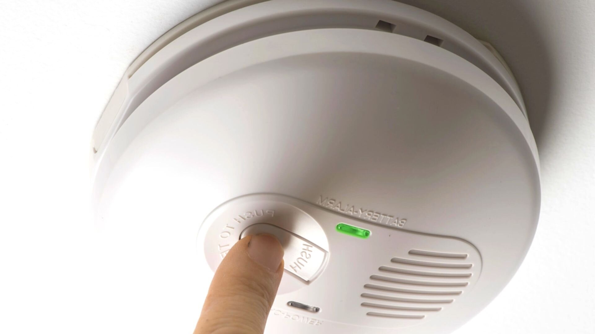 Perosn Testing Smoke Alarm