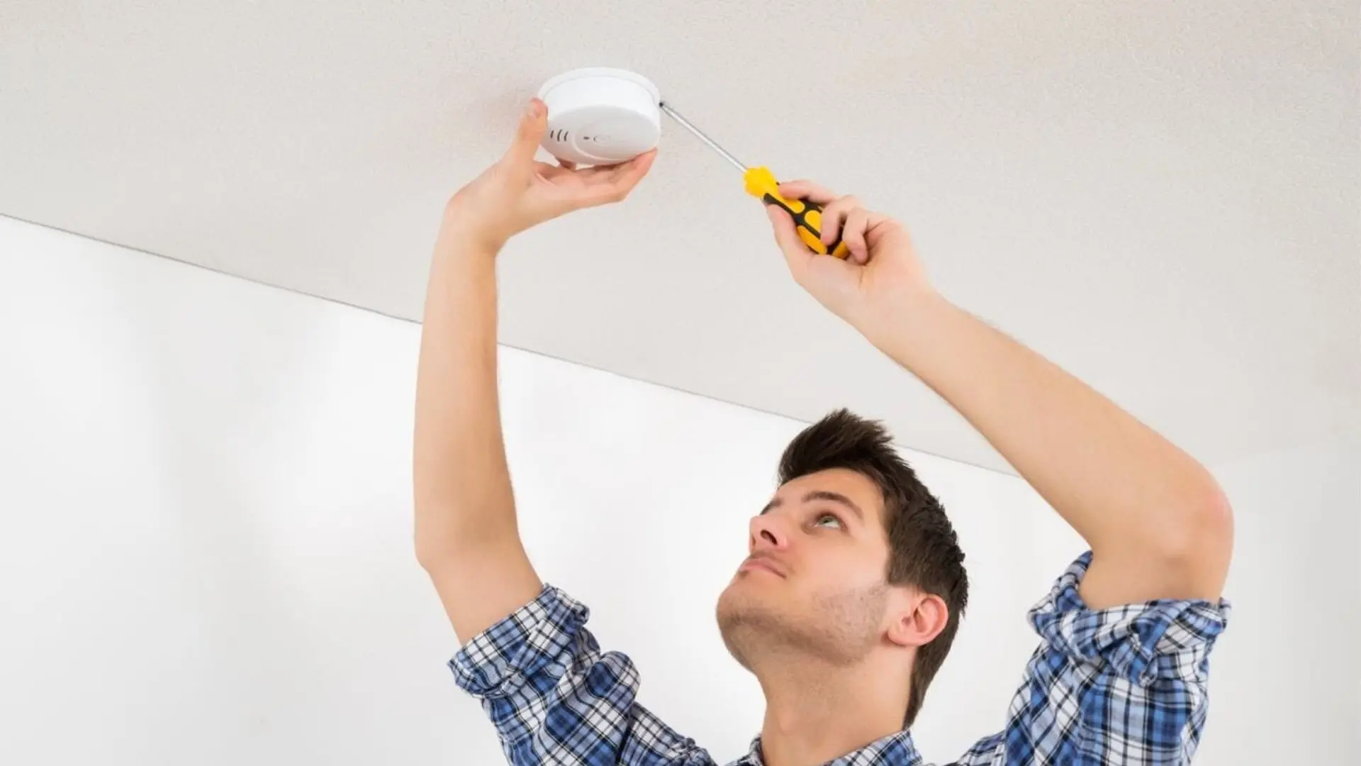 Person Screwdriver Smoke Alarm