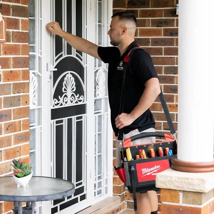 Electrician Knocking Customer Door