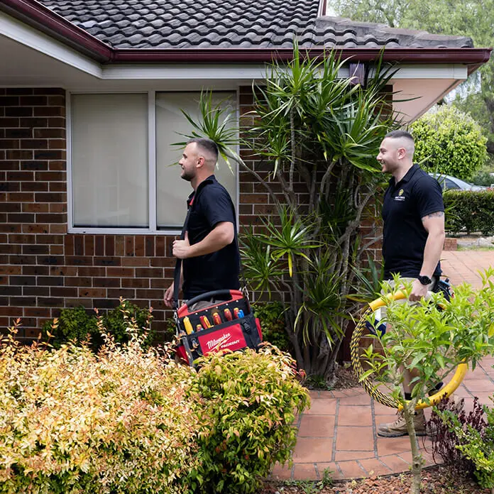 Electricians Walking Customer Door