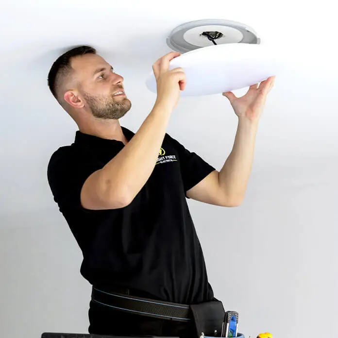 Qualified Electrician Installing Lights