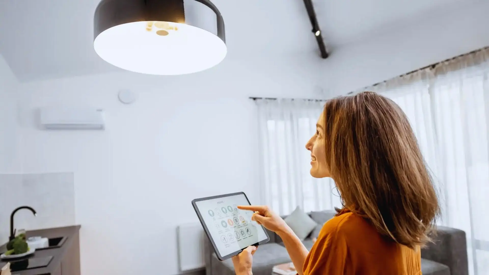 Woman Dimming Smart Lights