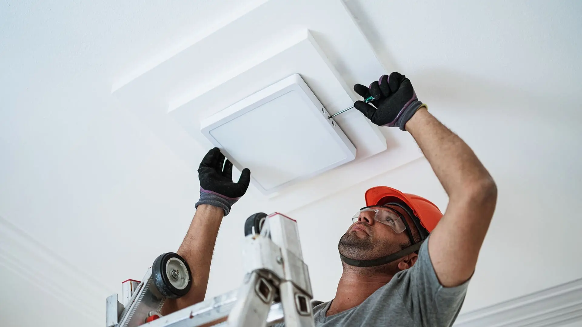 Electrician Installing Lighting Home Roof