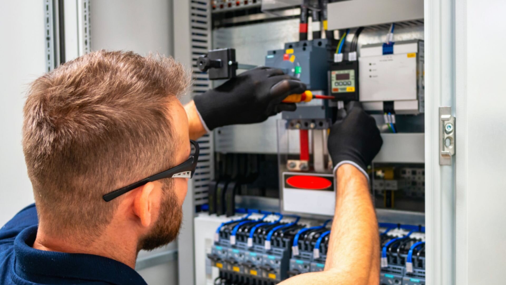 Man Fixing Power Breaker