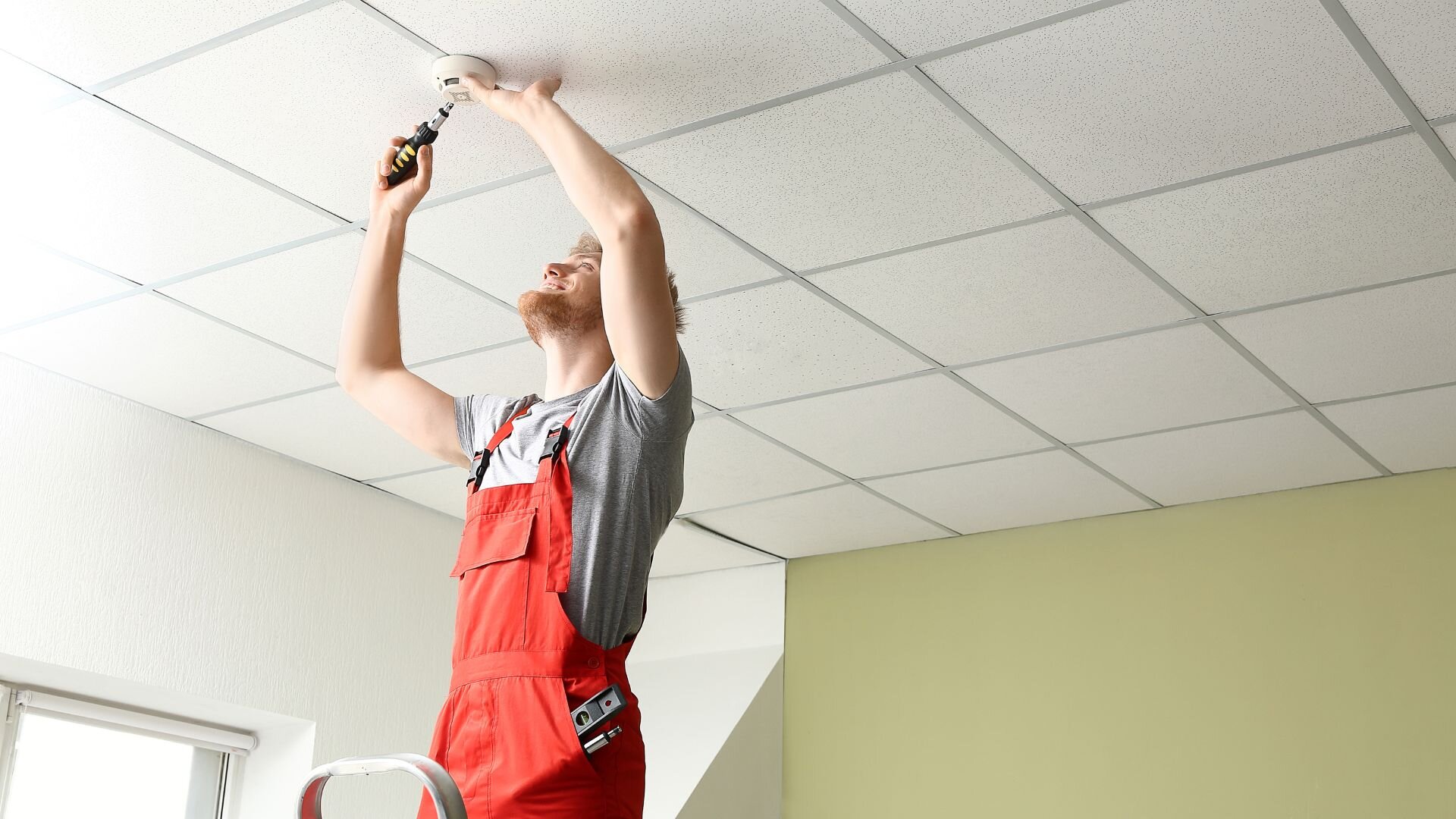 2024 02 Electrician Fixing Smoke Alarm Electrician Fixing Smoke Alarm