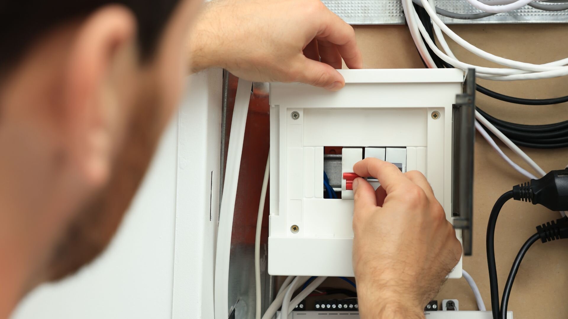 Electrician Testing Circuit Breaker