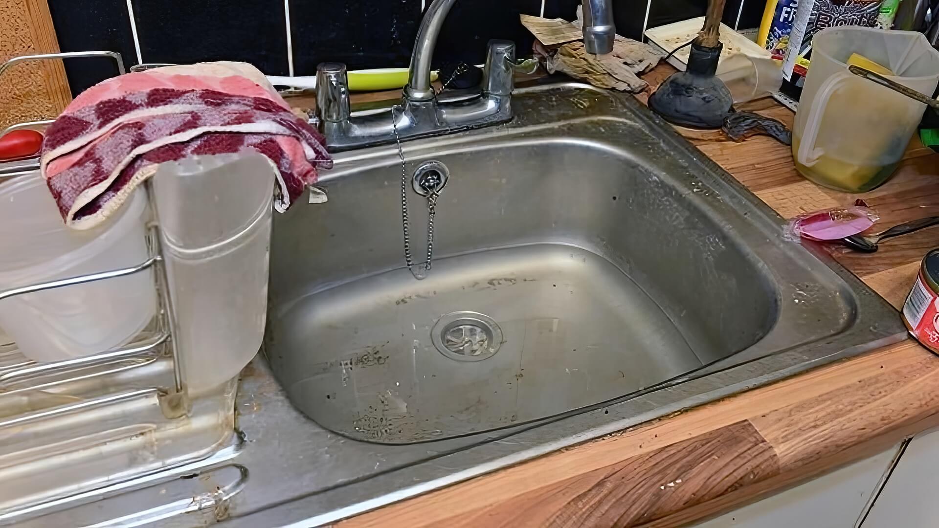 unclog kitchen sink with garden hose