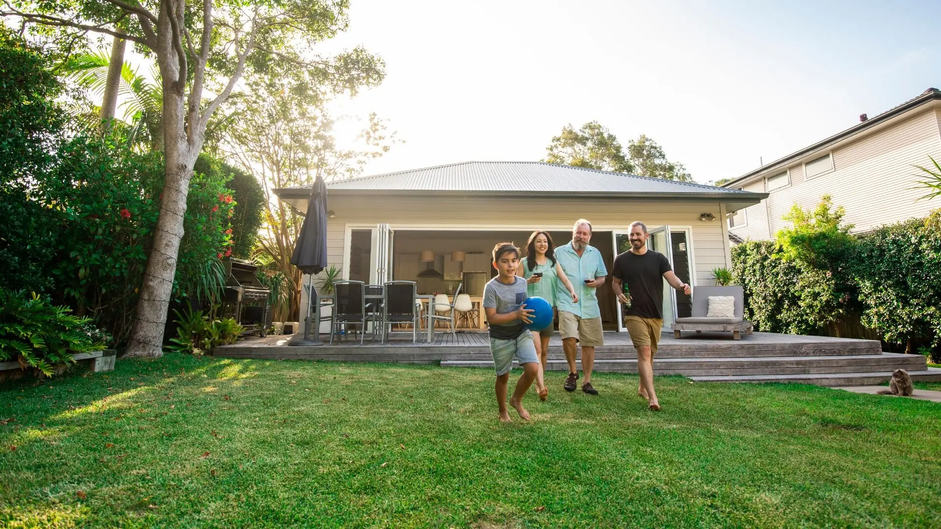 Sloping Yard Family Playing