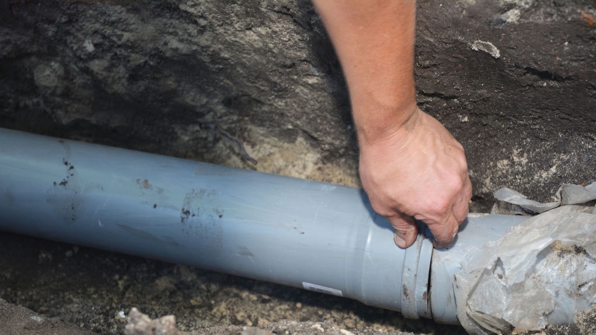 Plumber Fixing Sewer Clog Daycare