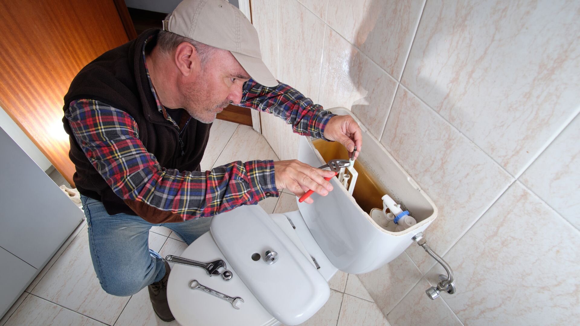 Man Fixing Toilet