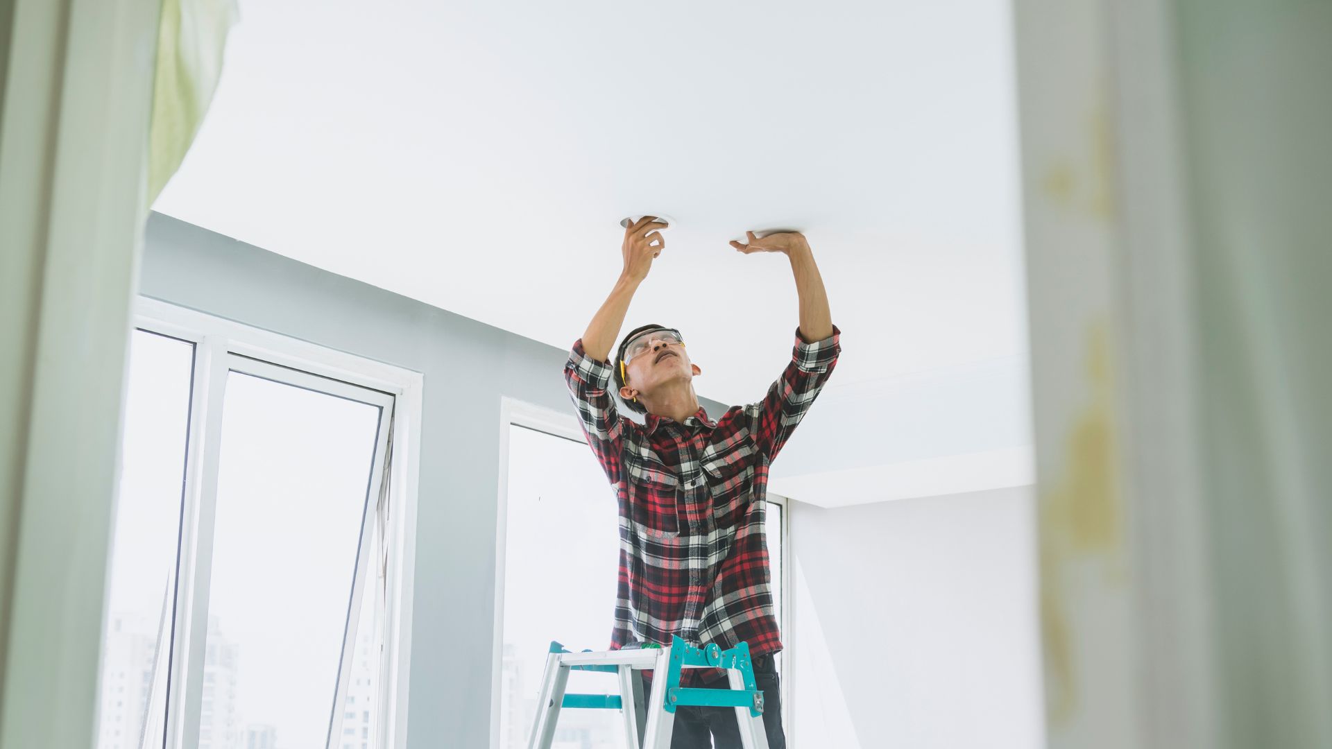 Electrician Installing Lights Renovation