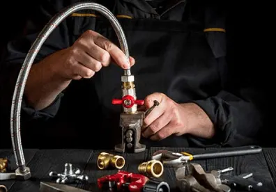 master plumber connects brass fittings plumbing hose close up hand master during work workshop a03e77f574