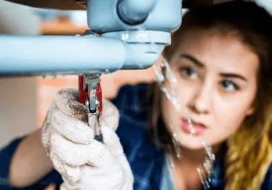 woman fixing her own toilet sink 614c073f64