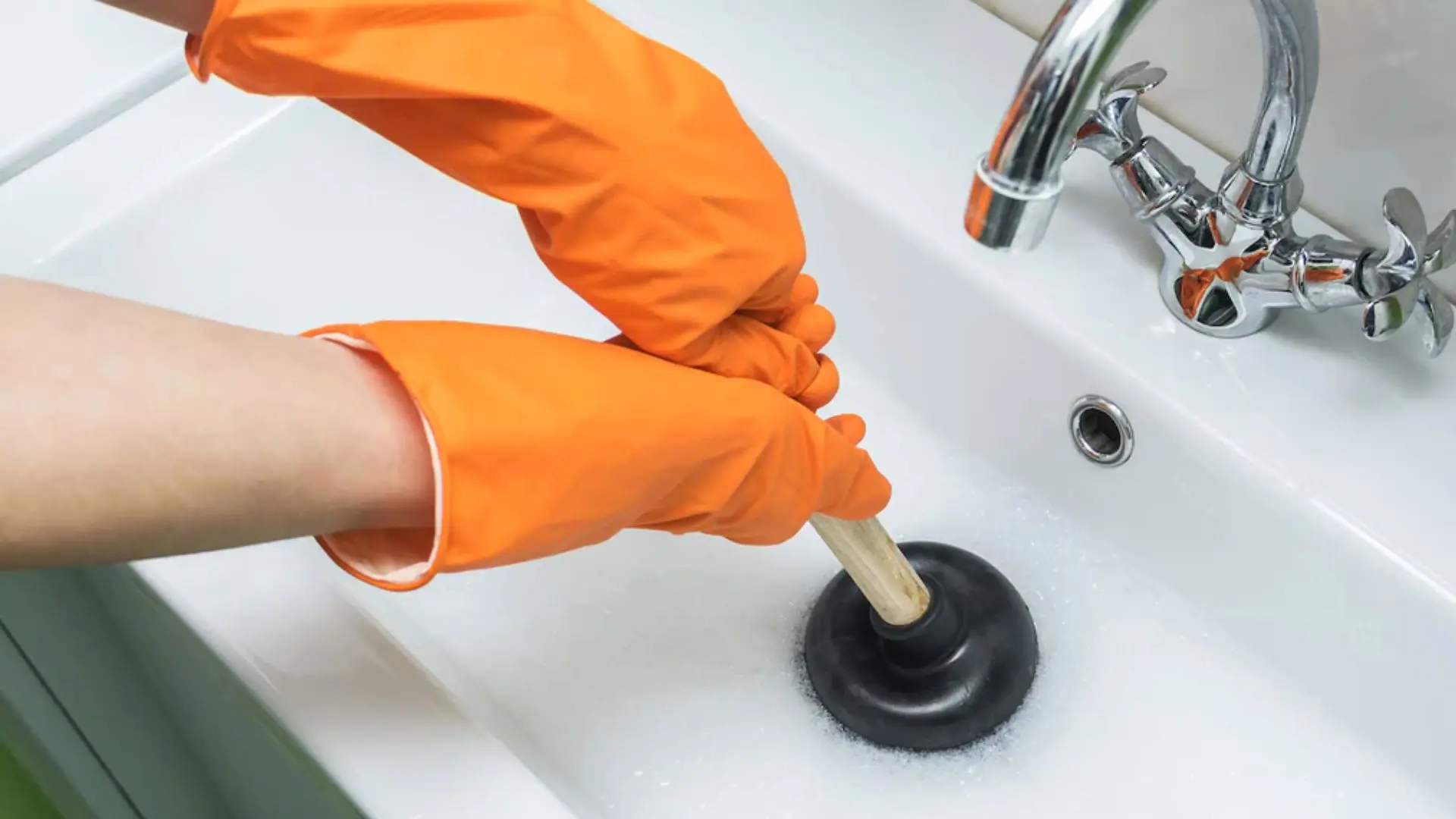 Unclogging Drain With Orange Gloves Unclogging Drain Orange Gloves