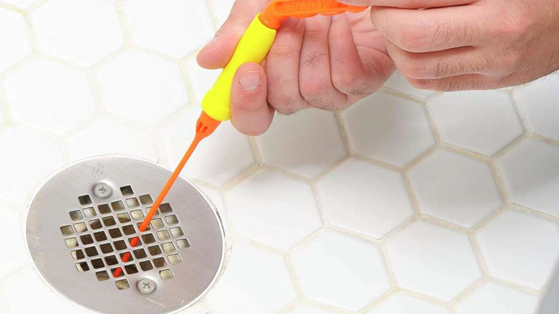 Using A Drain Snake To Clear Shower Drain 
