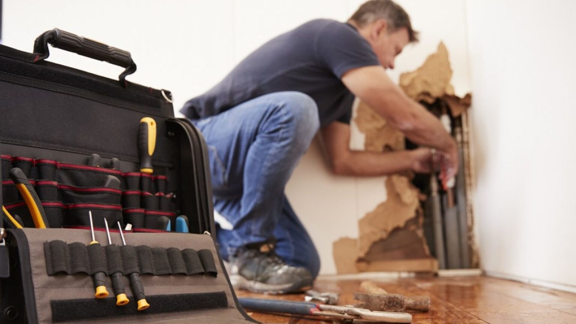 Plumber Maintaining Inner Wall Pipes Plumber Maintaining Wall Pipes