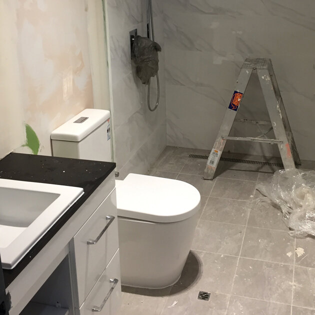 Man Repairing Toilet Man Repairing Toilet