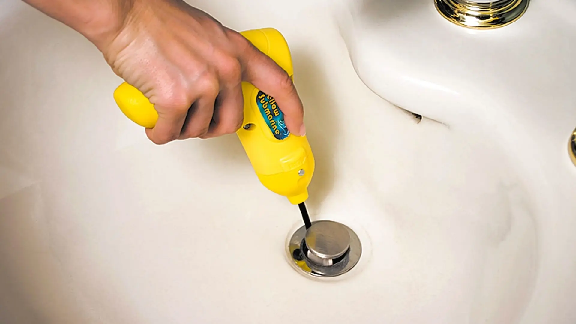 https://zeve.au/wp/uploads/2022/04/using-drain-auger-in-bathroom-sink-yellow.jpg