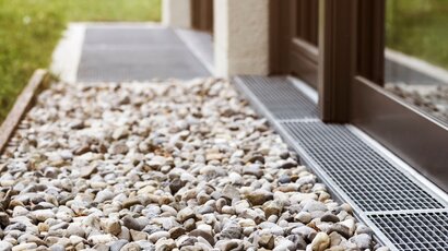 Why Outside Drainage Fails Without the Right Grates